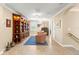 Bright sitting room featuring a built-in bookcase and views of the community at 10596 Lake Seminole Ter, Seminole, FL 33772