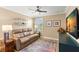 Cozy sitting room with comfortable seating, natural light, and pleasant decor at 10596 Lake Seminole Ter, Seminole, FL 33772