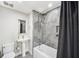 Modern bathroom with stylish gray tile shower, soaking tub, and pedestal sink at 1120 43Rd N Ave, St Petersburg, FL 33703