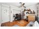 Bedroom featuring hardwood floors, grey sofa, ceiling fan, and natural light at 1120 43Rd N Ave, St Petersburg, FL 33703