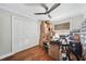 Bedroom featuring hardwood floors, a ceiling fan, and a window allowing natural light at 1120 43Rd N Ave, St Petersburg, FL 33703