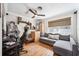Bedroom featuring hardwood floors, grey sofa, ceiling fan, and natural light at 1120 43Rd N Ave, St Petersburg, FL 33703