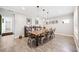 Open dining room with tile flooring, view of a bar, and a long table with seating for ten at 1120 43Rd N Ave, St Petersburg, FL 33703