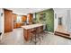Modern kitchen featuring a subway tile backsplash, stainless steel appliances, and an island with bar seating at 1120 43Rd N Ave, St Petersburg, FL 33703