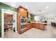 Spacious kitchen featuring modern stainless-steel appliances, hardwood cabinets, island with seating, and a walk-in pantry at 1120 43Rd N Ave, St Petersburg, FL 33703