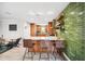 Bright, open kitchen with an island, bar seating, stainless steel appliances, and hardwood cabinets at 1120 43Rd N Ave, St Petersburg, FL 33703