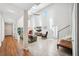 Spacious living room with a high ceiling, large windows, tile floor, and comfortable seating arrangements at 1120 43Rd N Ave, St Petersburg, FL 33703