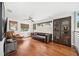 Cozy living room with hardwood floors, leather seating, and lots of natural light at 1120 43Rd N Ave, St Petersburg, FL 33703