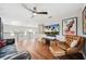 Upstairs living room featuring hardwood floors, modern decor, and lots of natural light at 1120 43Rd N Ave, St Petersburg, FL 33703