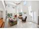 Bright living room with high ceilings, many windows, comfortable seating, and a view to the backyard at 1120 43Rd N Ave, St Petersburg, FL 33703