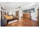 Large main bedroom features wood floors, a cozy sitting area, and a dresser with storage space at 1120 43Rd N Ave, St Petersburg, FL 33703
