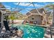 Screened-in pool featuring poolside seating, a diving board, and lush greenery in a private backyard setting at 1120 43Rd N Ave, St Petersburg, FL 33703