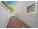 Side yard featuring brick pavers leading along the side of the home at 1120 43Rd N Ave, St Petersburg, FL 33703