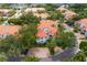 Aerial view of a stunning townhome community with mature landscaping, red tile roofs, and brick driveways at 1122 Shipwatch Cir, Tampa, FL 33602