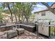 Outdoor deck with grill, seating and view of lush greenery at 1122 Shipwatch Cir, Tampa, FL 33602