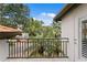 Balcony with metal railing offering lush views of palm trees and surrounding neighborhood at 1122 Shipwatch Cir, Tampa, FL 33602