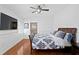 This stylish bedroom boasts a large wall-mounted television, bright walls, and a ceiling fan at 1122 Shipwatch Cir, Tampa, FL 33602