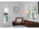 Comfortable reading nook with a leather chair, side table and light, and plantation shutters at 1122 Shipwatch Cir, Tampa, FL 33602