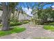 Exterior view of community buildings surrounding a charming brick courtyard with a decorative fountain feature at 1122 Shipwatch Cir, Tampa, FL 33602