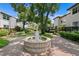 Inviting courtyard featuring a beautiful fountain, manicured landscaping, and serene walkways at 1122 Shipwatch Cir, Tampa, FL 33602
