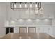 Elegant dining room with built-in cabinets, wine fridge, and a view of backyard at 1122 Shipwatch Cir, Tampa, FL 33602
