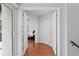 Inviting entryway featuring light walls, gleaming wood floors, and an open view into the primary bedroom at 1122 Shipwatch Cir, Tampa, FL 33602
