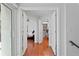 Inviting entryway featuring light walls, gleaming wood floors, and an open view into the primary bedroom at 1122 Shipwatch Cir, Tampa, FL 33602