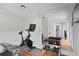 Home gym equipped with exercise bike, weight bench, free weights, large mirror, and a TV at 1122 Shipwatch Cir, Tampa, FL 33602