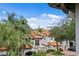 Exterior view of townhomes with lush greenery and well-maintained landscaping at 1122 Shipwatch Cir, Tampa, FL 33602