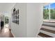 Second floor hallway leading to balcony, home office and bedrooms at 1122 Shipwatch Cir, Tampa, FL 33602