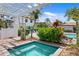 Community hot tub featuring clear blue water, with shade cover and surrounding manicured landscape at 1122 Shipwatch Cir, Tampa, FL 33602