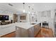 Spacious open kitchen with island, stainless steel appliances and hardwood floors at 1122 Shipwatch Cir, Tampa, FL 33602