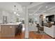 View of the open kitchen and living area with a center island and stainless steel appliances at 1122 Shipwatch Cir, Tampa, FL 33602