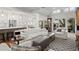 Bright open-concept living room featuring a modern kitchen and an outdoor patio at 1122 Shipwatch Cir, Tampa, FL 33602