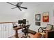 Home office area features desk, dual monitors, ceiling fan, and wood floors at 1122 Shipwatch Cir, Tampa, FL 33602