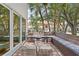 Inviting patio with built-in seating, fire pit, and stylish wicker tables for relaxing outdoor living at 1122 Shipwatch Cir, Tampa, FL 33602