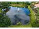 Picturesque pond with fountain, beautiful landscaping and a walking path along the perimeter at 1122 Shipwatch Cir, Tampa, FL 33602