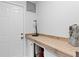 Bright storage room with custom cabinets and a wood countertop at 1122 Shipwatch Cir, Tampa, FL 33602