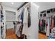 This large walk-in closet has ample built-in storage and wood floors at 1122 Shipwatch Cir, Tampa, FL 33602