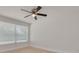 Bright bedroom with a ceiling fan, wood floors and large windows providing natural light at 11296 115Th St, Largo, FL 33778