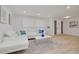 Bright living room with ample natural light, modern furniture, and light wood flooring perfect for relaxing and entertaining at 11296 115Th St, Largo, FL 33778