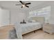 Serene main bedroom with natural light, complemented by wood-look floors and ample closet space at 11296 115Th St, Largo, FL 33778