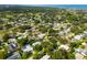 Aerial view of the property in a quiet, established neighborhood near a golf course and the bay at 1235 Nelson St, Dunedin, FL 34698