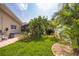 Lush backyard with brick-lined garden beds, providing a serene outdoor retreat at 1235 Nelson St, Dunedin, FL 34698