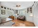 Bedroom featuring hardwood floors, a ceiling fan, and ample storage cabinets at 1235 Nelson St, Dunedin, FL 34698