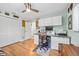 Bedroom featuring hardwood floors, a ceiling fan, and closet space with ample storage at 1235 Nelson St, Dunedin, FL 34698