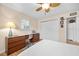 Bedroom featuring hardwood floors, a ceiling fan, and natural light with a built-in desk at 1235 Nelson St, Dunedin, FL 34698