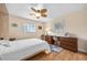 Bedroom featuring hardwood floors, a ceiling fan, and natural light with a workspace at 1235 Nelson St, Dunedin, FL 34698