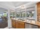 Kitchen view highlighting granite counters and a window overlooking the screened pool area at 1235 Nelson St, Dunedin, FL 34698