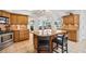 A spacious kitchen with granite countertops, a center island and wood cabinets at 1235 Nelson St, Dunedin, FL 34698